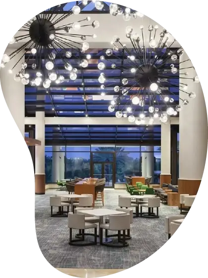 Luxury hospitality interior designed by SoyLusso with custom lighting and elegant contemporary furnishings.
