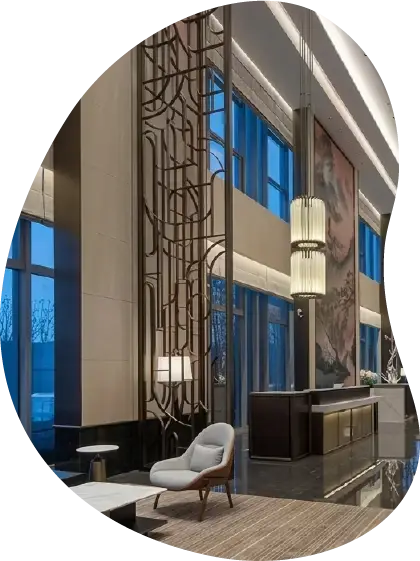 Luxury hotel lobby designed by SoyLusso featuring contemporary architecture and premium finishes.