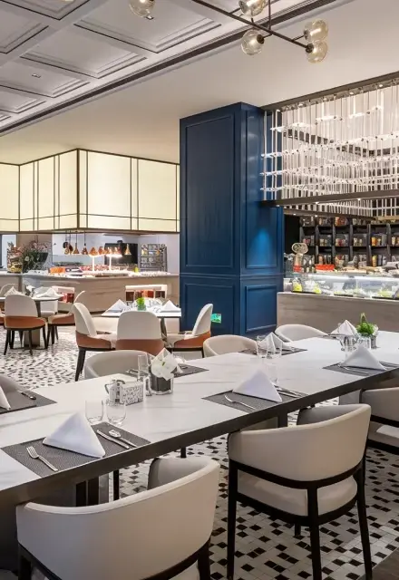 Luxury restaurant interior designed by SoyLusso featuring contemporary furnishings, elegant lighting and premium finishes.